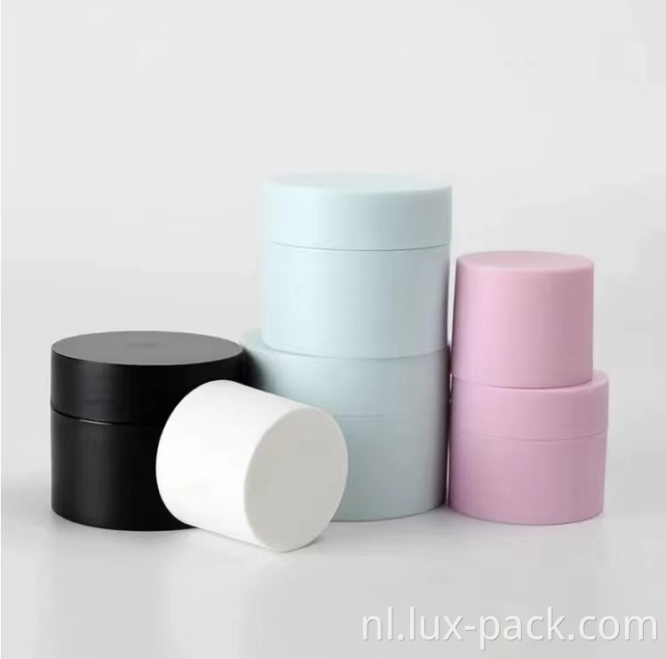 Groothandel lege zwart wit roze blauw mat plastic emulsie cosmetische crème container